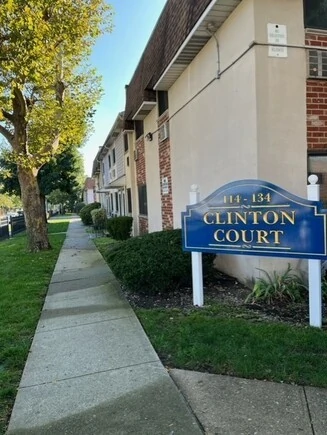 Exterior view of Clinton Court apartment complex sign.